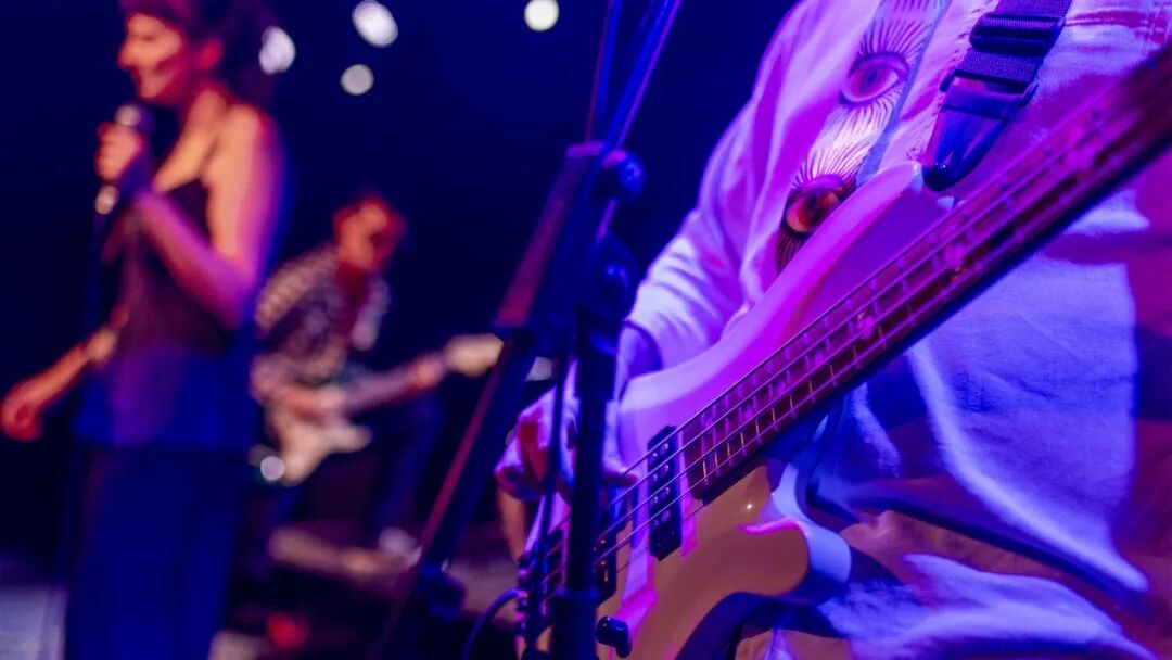 A band performing on a livehouse stage